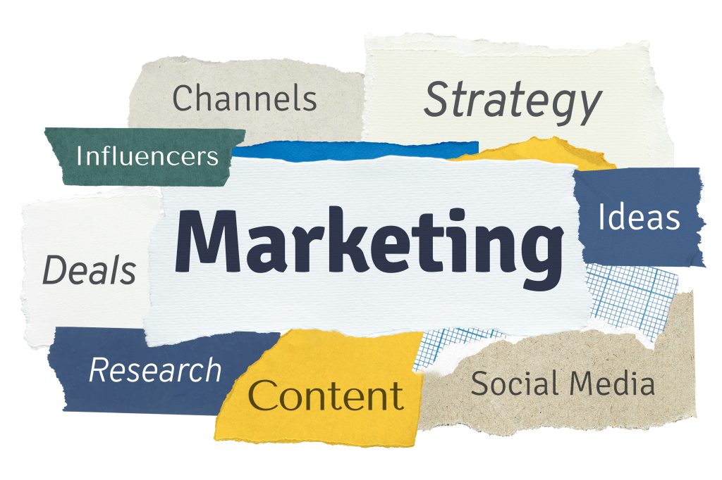 Marketing word collage on torn paper symbolizing fragmented marketing process