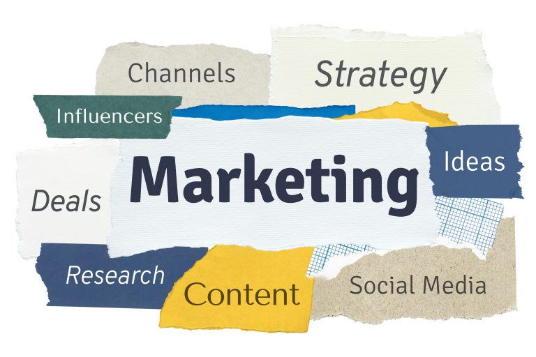 Marketing word collage on torn paper symbolizing fragmented marketing process